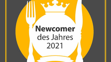 ATLANTIC Grillroom Newcomer des Jahres 2021 Auszeichnung "Newcomer des Jahres 2021" von "münster geht aus" auf grauem Hintergrund.