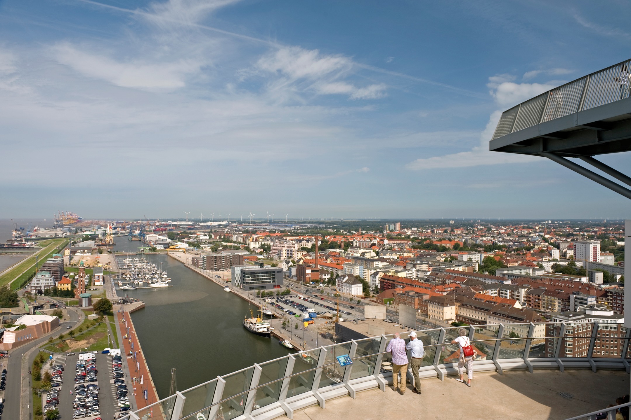 View over Bremerhaven from the observation deck in the ATLANTIC Hotel SAIL City View from the viewing platform of the ATLANTIC Hotel Sail City over Bremerhaven and the harbor on a clear day.