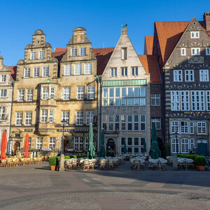 Bremen market place in the old town Historic facades on Bremen's market square with outdoor catering and parasols on a clear day.