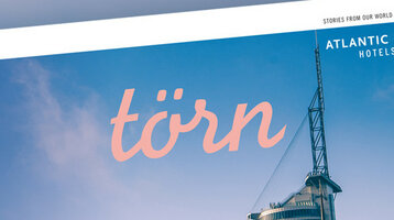 törn – ATLANTIC Hotels house magazine 21/23 Magazine title "törn" in front of blue sky, showing modern building and logo of Atlantic Hotels.
