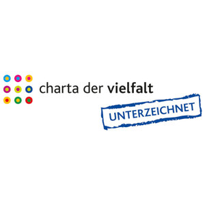 Das Logo der Charta der Vielfalt bestehend aus neun Kreisen in jeweils zwei Farben und daneben einem Stempel: „unterzeichnet“