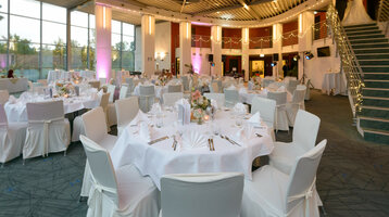 Wedding at the ATLANTIC Hotel Universum Elegant banquet hall in the ATLANTIC Hotel Universum, festively laid tables, subtle lighting, wedding atmosphere.