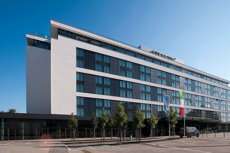 Modern hotel façade of the ATLANTIC Congress Hotel in Essen with lots of glass.