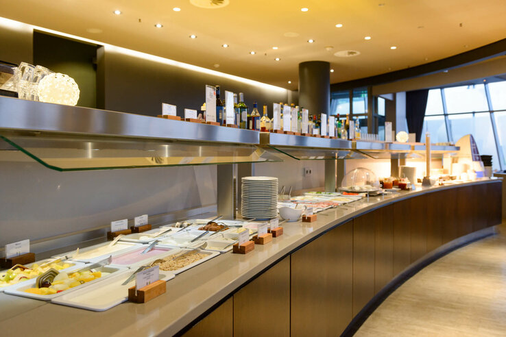 Breakfast buffet in the ATLANTIC Hotel Sail City Breakfast buffet at the ATLANTIC Hotel Sail City with various dishes and drinks in a modern ambience.