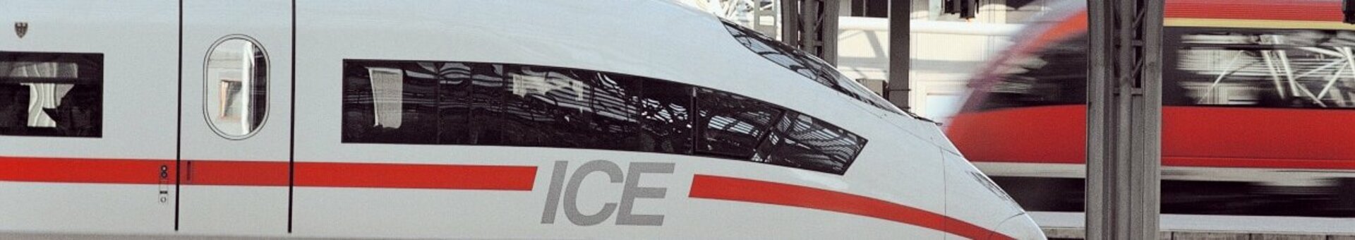 Meeting Ticket by Deutsche Bahn for events at the ATLANTIC Hotels Modern station with an ICE train in the foreground and another train in the background under a vaulted glass roof.