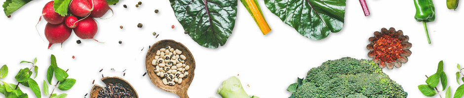 United Against Waste – ATLANTIC Hotels Fresh vegetables and spices on a white background, including radishes, chard, broccoli and herbs.