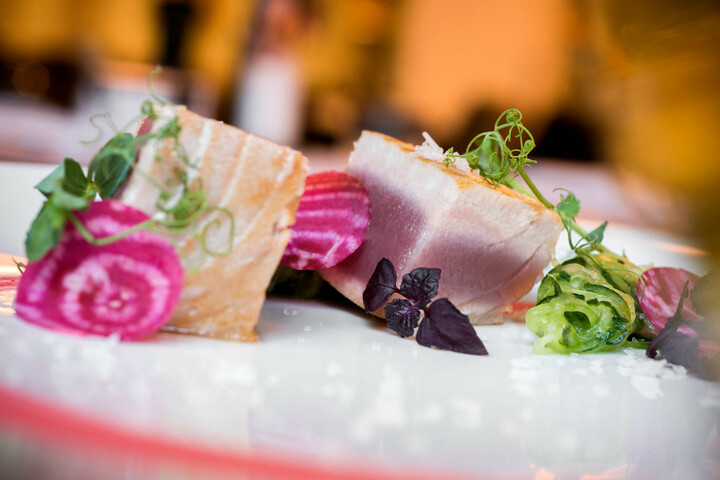 Food and beverage | Events at ATLANTIC Hotel Lübeck Gourmet plate with tuna, beet, zucchinis and edible flowers, served in style at the ATLANTIC Hotel Lübeck.