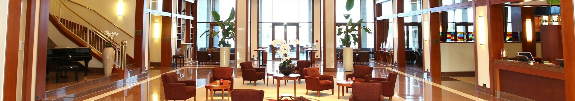 Hotel lobby with a seating area in the ATLANTIC Hotel Wilhelmshaven  Hotel lobby with a seating area in the ATLANTIC Hotel Wilhelmshaven